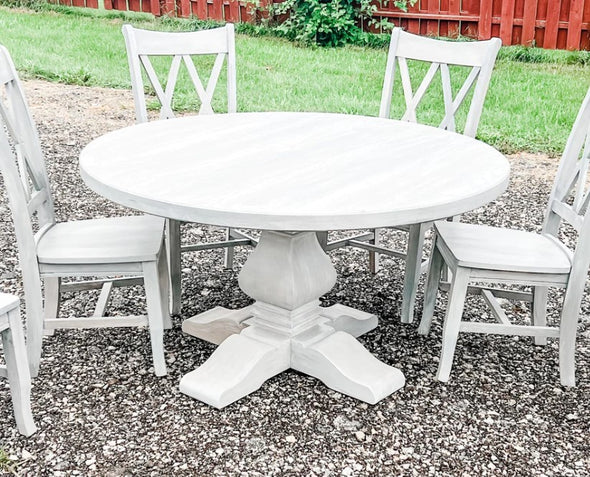 Round hardwood dining table all white with 4 white double X back chairs