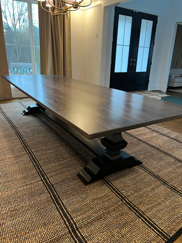 hardwood dining table dark stain no chairs tan rug