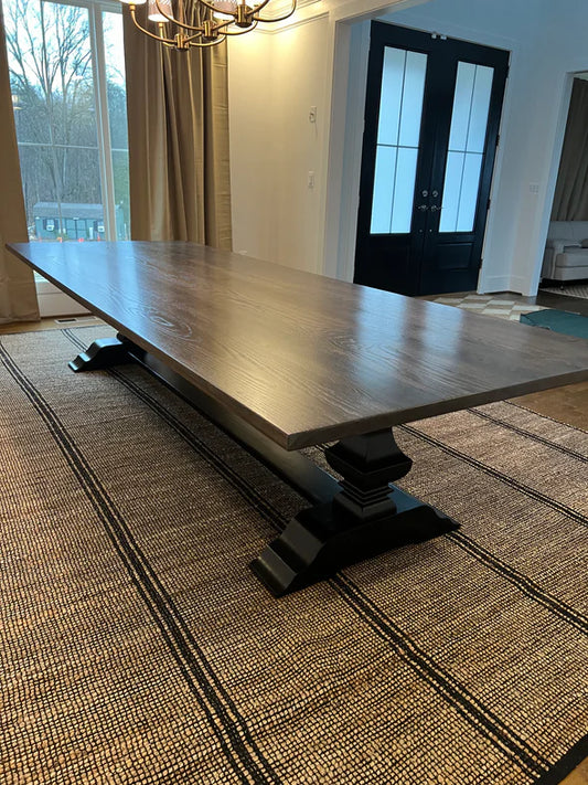 hardwood dining table dark stain no chairs tan rug