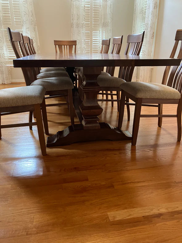 Johnson dining table with upholstered chairs light hardwood floor light background