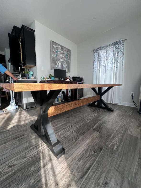 Hardwood dining table light brown top with black trestle legs