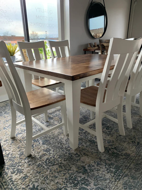 Hardwood Dining table brown top with white legs 6 white chairs with stained seats to match tabletop on blue and white rug