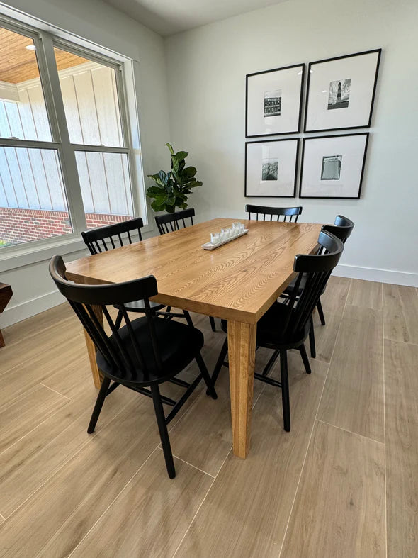 Hardwood dining table oak with light stain 6 black chairs